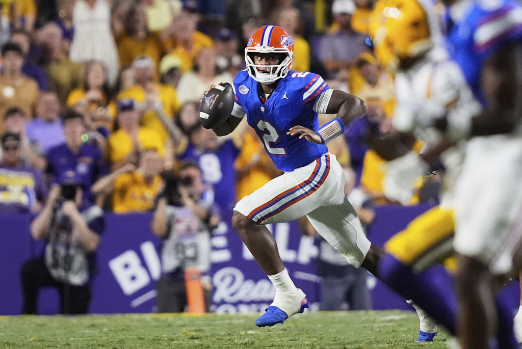 Florida quarterback DJ Lagway (2) scrambles in the first half of an NCAA college football game, Saturday, Sept. 13, 2025, in Baton Rouge, La. (AP Photo/Gerald Herbert)