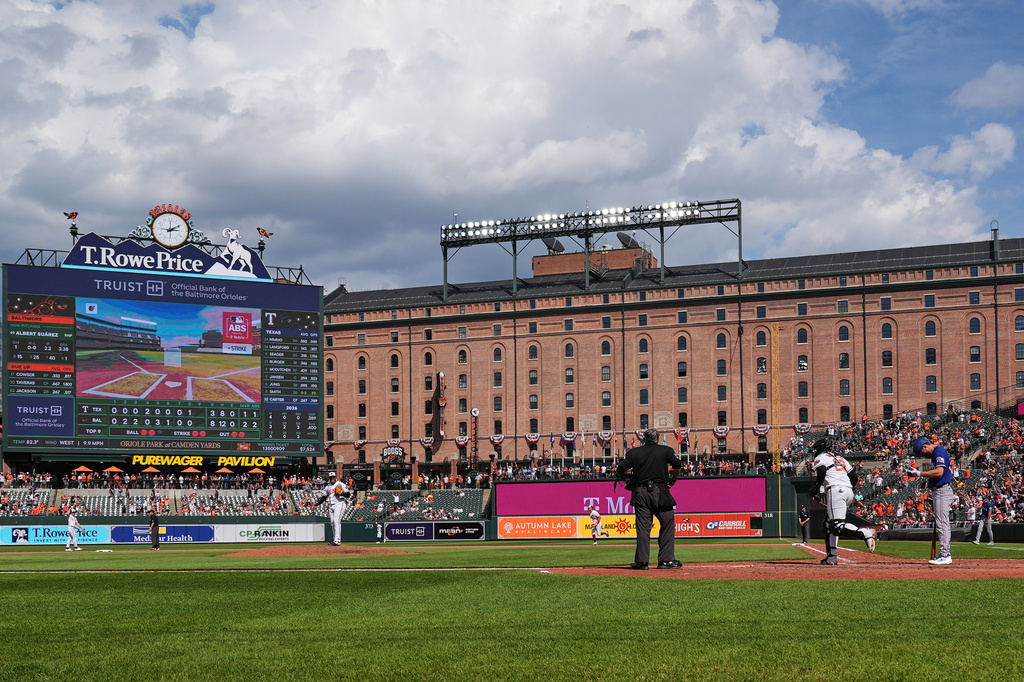 A called ball is overturned through the Automated Ball-Strike system, resulting in a win for the Baltimore Orioles over the Texas Rangers in the ninth inning of a baseball game, Wednesday, April 1, 2026, in Baltimore. (AP Photo/Stephanie Scarbrough)