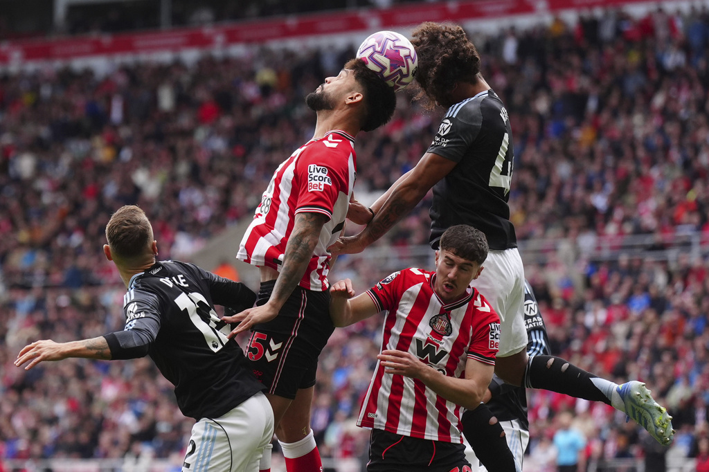 Sunderland's Omar Alderete and Aston Villa's Boubacar Kamara, right, in action during the English Premier League soccer match between Sunderland and Aston Villa at the Stadium of Light, in Sunderland, England, Sunday Sept. 21, 2025. (Owen Humphreys/PA via AP)