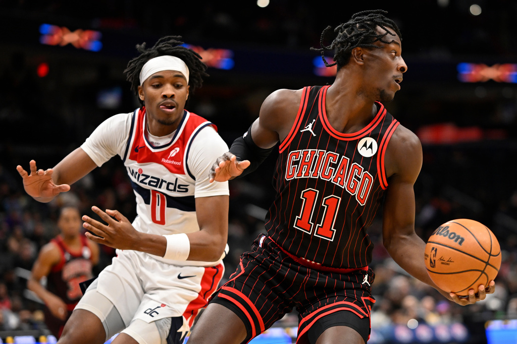 Washington Wizards guard Bilal Coulibaly guards Chicago Bulls forward Leonard Miller (11) during the first half of an NBA basketball game, Tuesday, April 7, 2026, in Washington. (AP Photo/John McDonnell)