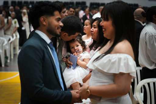 Couples attend a group ceremony organized by the Civil Registry to legally formalize their unions in in Asuncion, Paraguay, Saturday, Oct. 4, 2025. (AP Photo/Jorge Saenz) Couples attend a group ceremony organized by the Civil Registry to legally formalize their unions in in Asuncion, Paraguay, Saturday, Oct. 4, 2025. (AP Photo/Jorge Saenz)