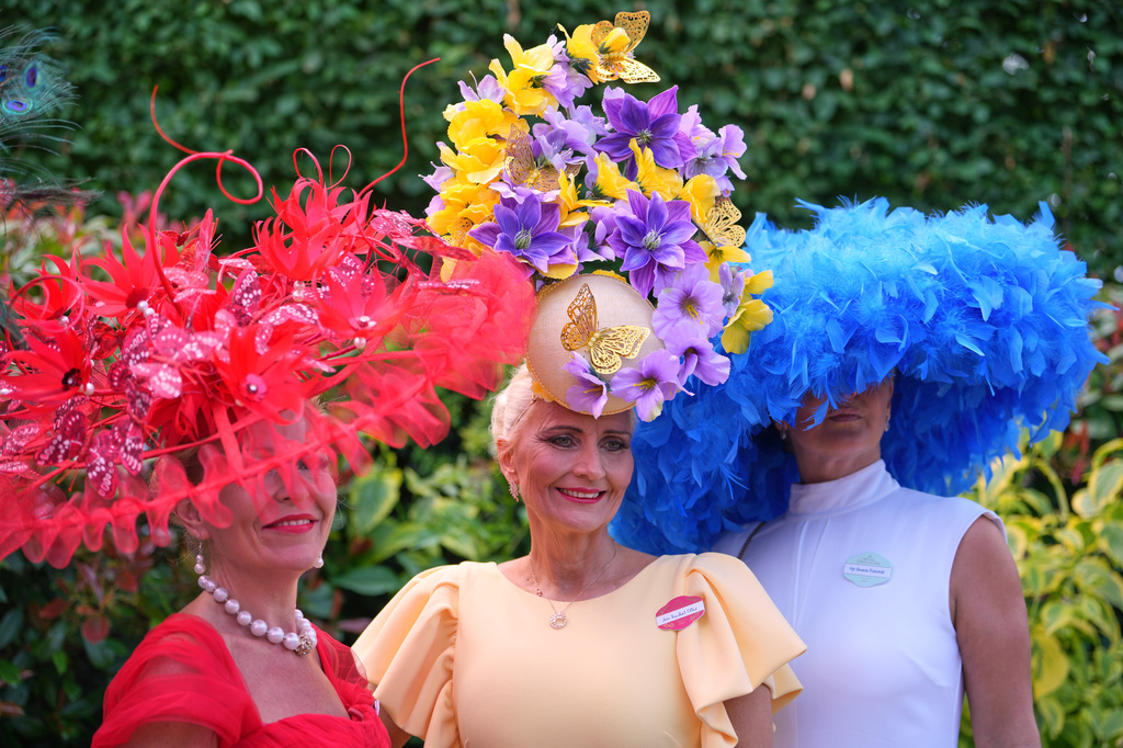 Racegoers pose for picyures on the first day of the Royal Ascot horse race meeting in Ascot, England, Tuesday, June 16, 2026.(AP Photo/Kin Cheung)