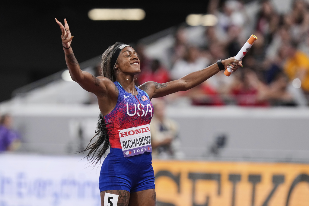 United States' Sha'Carri Richardson reacts after winning the women's 4 X 100 meters relay at the World Athletics Championships in Tokyo, Sunday, Sept. 21, 2025. (AP Photo/Eugene Hoshiko)