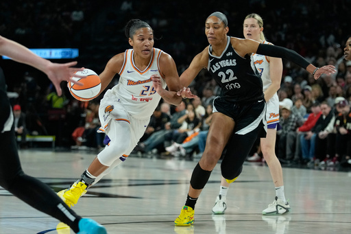 Phoenix Mercury forward Alyssa Thomas (25) drives was Las Vegas Aces center A'ja Wilson (22) defends during the first half in Game 1 of a WNBA basketball final playoff series Friday, Oct. 3, 2025, in Las Vegas. (AP Photo/John Locher) Phoenix Mercury forward Alyssa Thomas (25) drives was Las Vegas Aces center A'ja Wilson (22) defends during the first half in Game 1 of a WNBA basketball final playoff series Friday, Oct. 3, 2025, in Las Vegas. (AP Photo/John Locher)