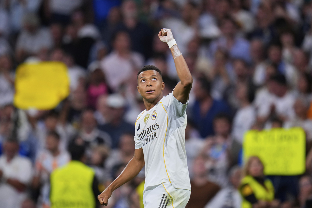 Real Madrid's Kylian Mbappe celebrates after scoring his side's second goal during a Champions League opening phase soccer match between Real Madrid and Marseille at Santiago Bernabeu stadium, in Madrid, Tuesday, Sept. 16, 2025. (AP Photo/Manu Fernandez)