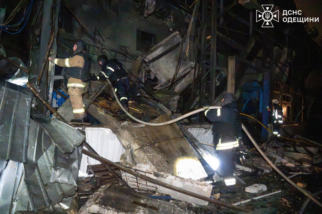 In this photo provided by the Ukrainian Emergency Service, emergency services personnel work to extinguish a fire following a Russian attack in Odesa region, Ukraine, Thursday, Jan. 29, 2026. (Ukrainian Emergency Service via AP)