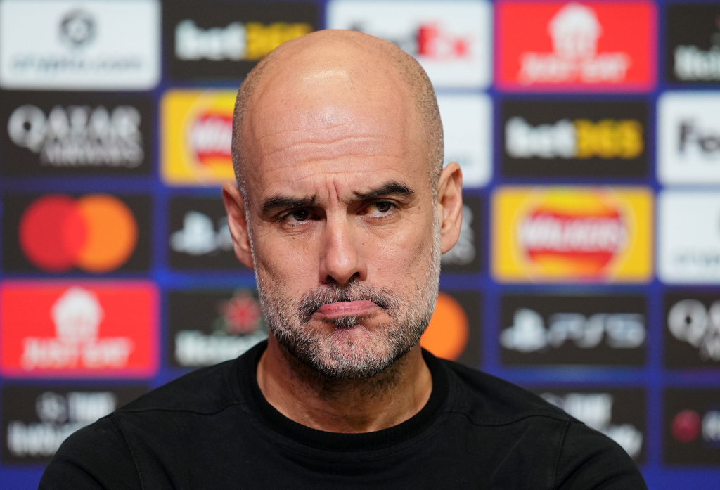 Manchester City manager Pep Guardiola looks on during a press conference in Manchester, England, Tuesday Jan. 27, 2026, one day ahead of their Champions League soccer match against Galatasaray. (Martin Rickett/PA via AP)
