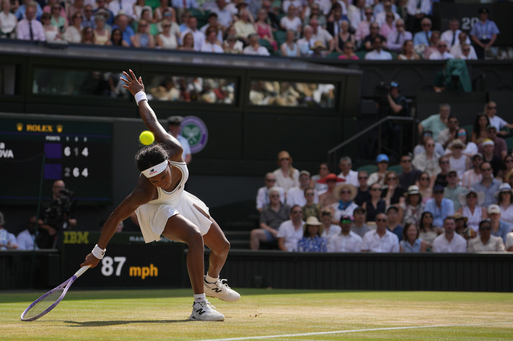 Coco Gauff of the United States loses her balance during a point against Karolina Muchova of the Czech Republic in their semifinal women's singles match at the Wimbledon Tennis Championships in London, Thursday, July 9, 2026. (AP Photo/Kin Cheung)