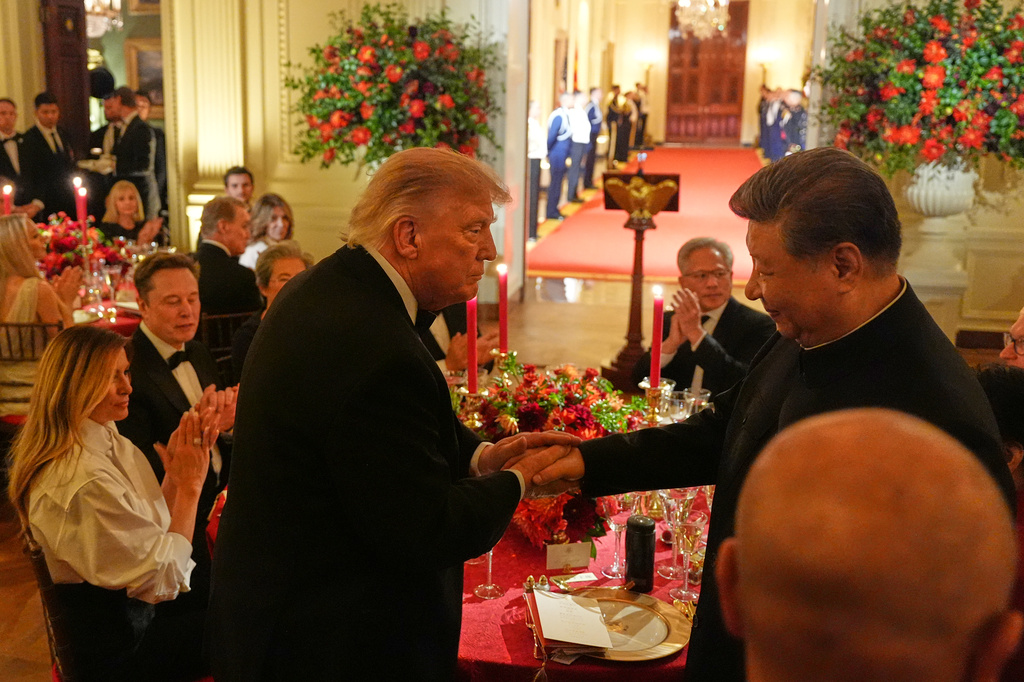 President Donald Trump shakes hands with China's President Xi Jinping in the East Room of the White House during a State Dinner, Thursday, Sept. 24, 2026, in Washington. (AP Photo/Alex Brandon)
