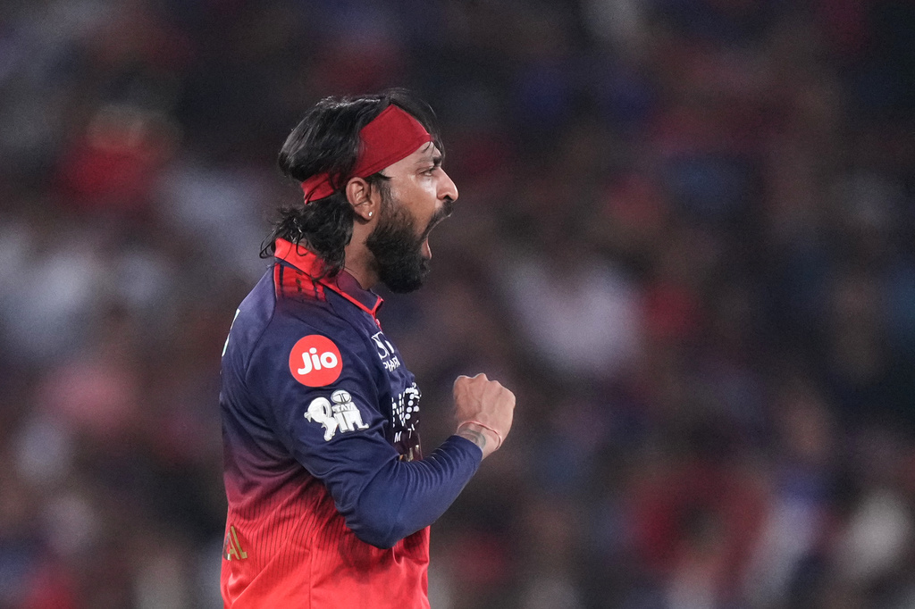 Royal Challengers Bengaluru's Krunal Pandya celebrates the wicket of Gujarat Titans' Jos Buttler during the Indian Premier League final cricket match between Gujarat Titans and Royal Challengers Bengaluru in Ahmedabad, India, Sunday, May 31, 2026. (AP Photo/Ajit Solanki)