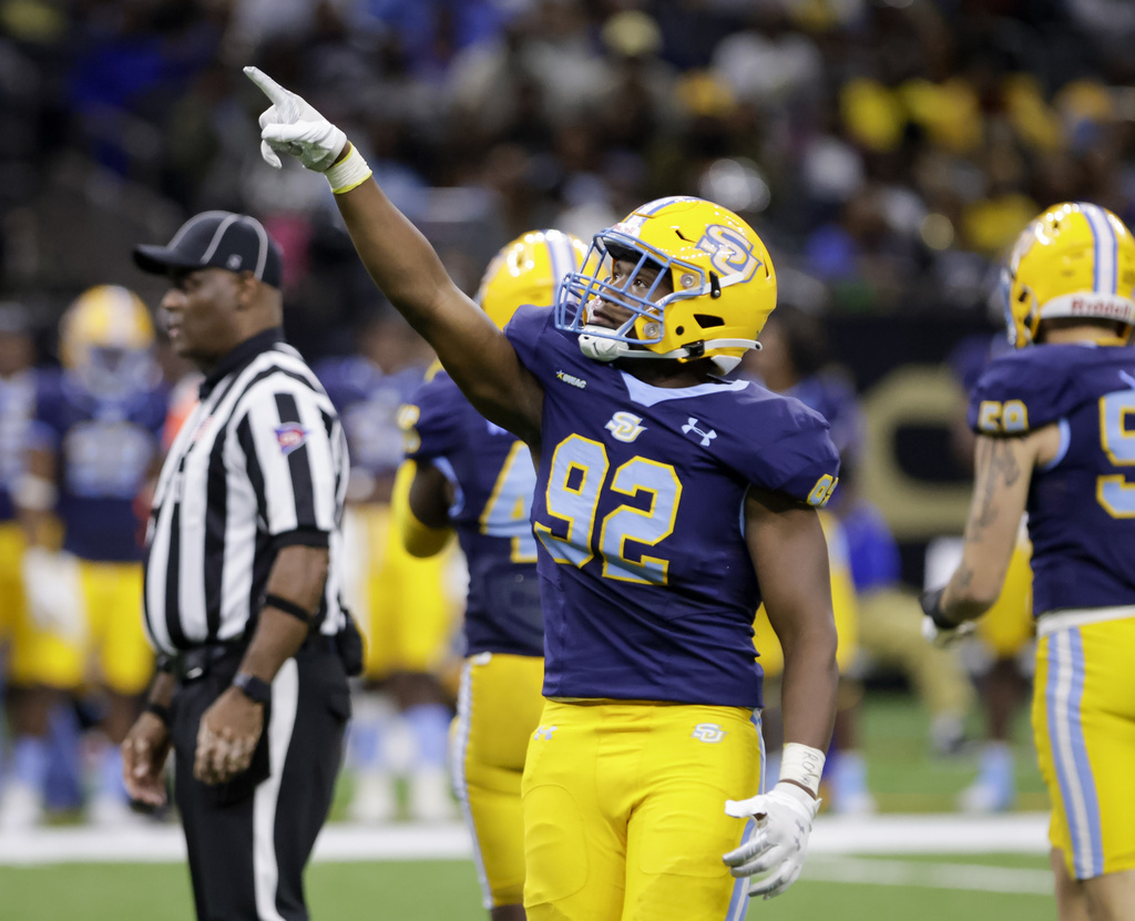 Southern defensive tackle Ckelby Givens (92) celebrates after sacking Grambling quarterback Julian Calvez (4) during the second half of the 49th Bayou Classic NCAA college football game, Nov. 26, 2022, at the Caesars Superdome in New Orleans. (Scott Threlkeld/The Times-Picayune/The New Orleans Advocate via AP)