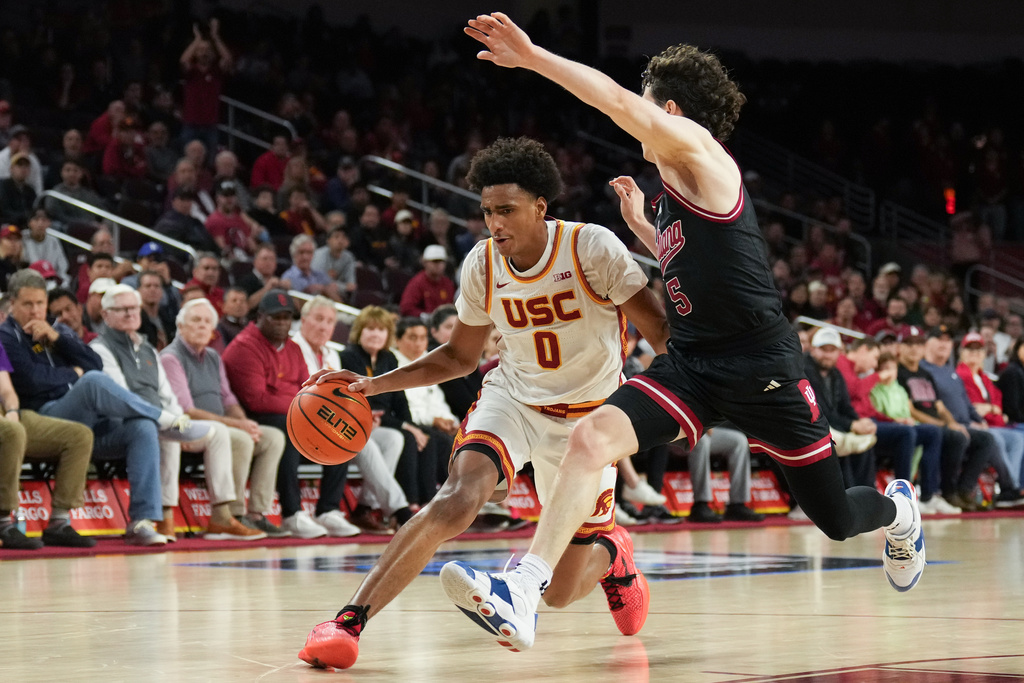 Southern California guard Alijah Arenas (0) is pressured by Indiana guard Conor Enright (5) during the second half of an NCAA college basketball game in Los Angeles, Tuesday, Feb. 3, 2026. (AP Photo/Jae C. Hong)