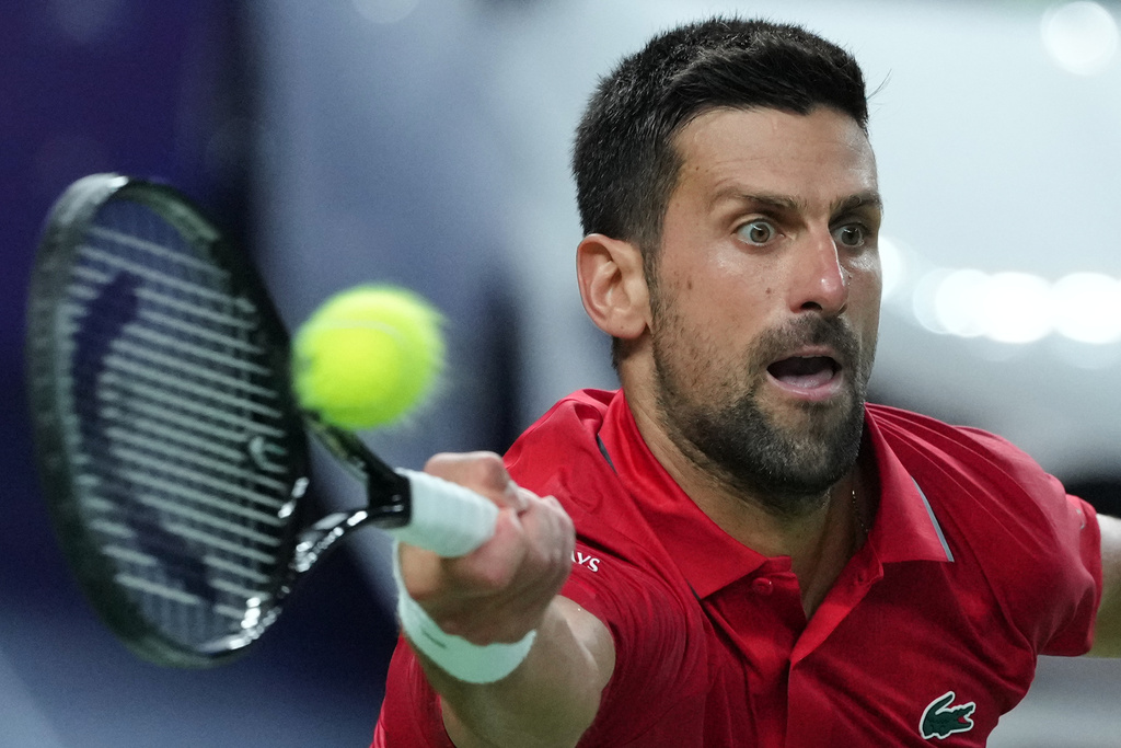 Novak Djokovic of Serbia returns a backhand shot from Zizou Bergs of Belgium during the men's singles quarterfinal match of the Shanghai Masters tennis tournament at Qizhong Forest Sports City Tennis Center, in Shanghai, China, Thursday, Oct. 9, 2025. (AP Photo/Andy Wong)