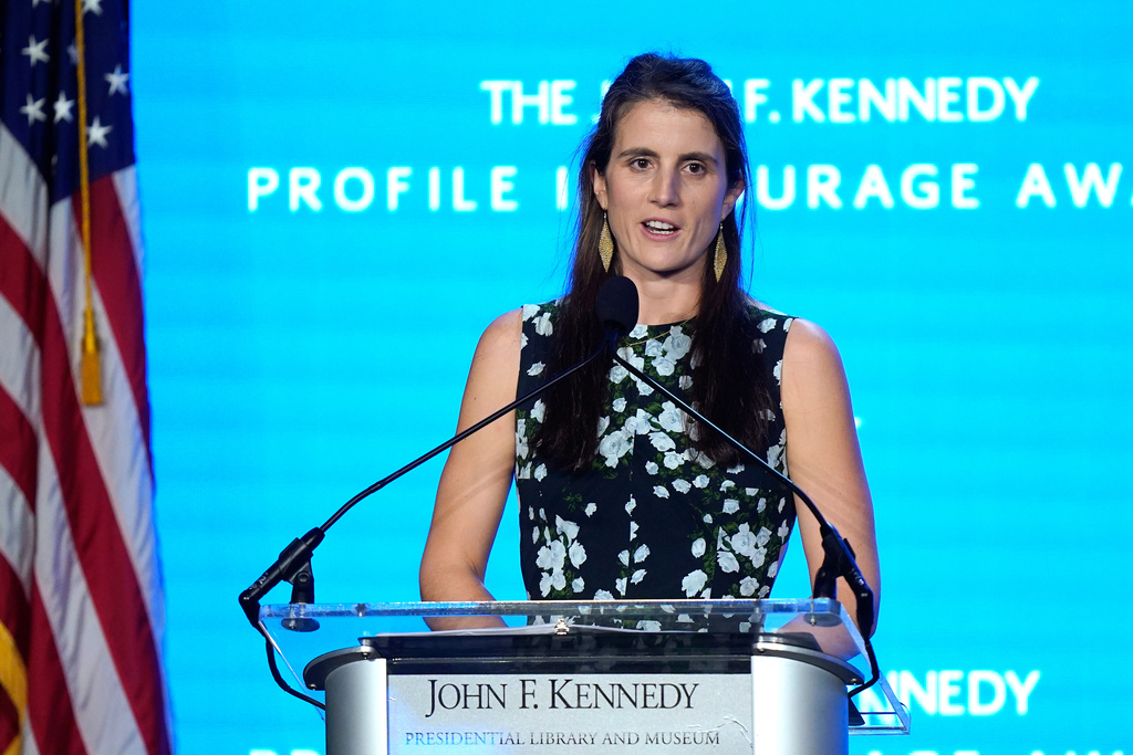 FILE - Tatiana Schlossberg, the daughter of Caroline Kennedy and Edwin Schlossberg, addresses an audience during the John F. Kennedy Profile in Courage Award ceremony, at the John F. Kennedy Presidential Library and Museum in Boston, Oct. 29, 2023. (AP Photo/Steven Senne, File)
