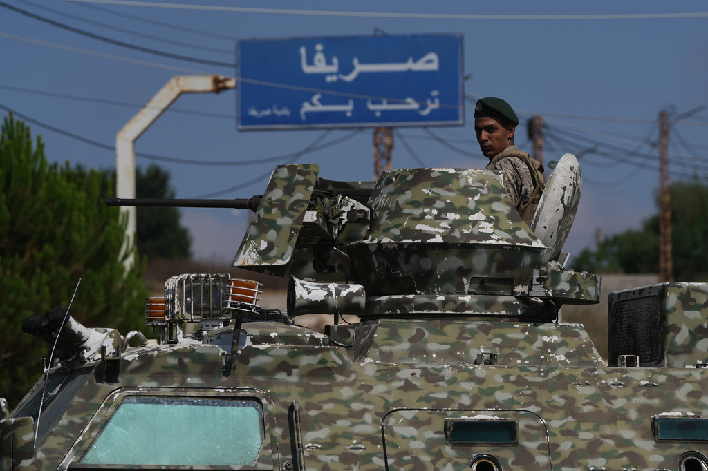 A Lebanese soldier stands atop an armored personnel carrier while manning a checkpoint at the entrance to Srifa village in southern Lebanon, Tuesday, July 21, 2026. (AP Photo/Hassan Ammar)