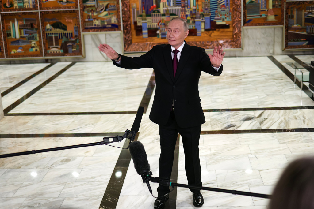 Russian President Vladimir Putin gestures speaking to journalists after the plenary session of the VTB "Russia Calling" Investment forum in Moscow, Tuesday, Dec. 2, 2025. (Sergei Ilnitsky/Pool Photo via AP)