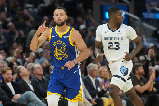 Golden State Warriors guard Stephen Curry (30) gestures after making a 3-point basket next to Memphis Grizzlies forward Cedric Coward (23) during the first half of an NBA basketball game in San Francisco, Monday, Oct. 27, 2025. (AP Photo/Jeff Chiu) Golden State Warriors guard Stephen Curry (30) gestures after making a 3-point basket next to Memphis Grizzlies forward Cedric Coward (23) during the first half of an NBA basketball game in San Francisco, Monday, Oct. 27, 2025. (AP Photo/Jeff Chiu)