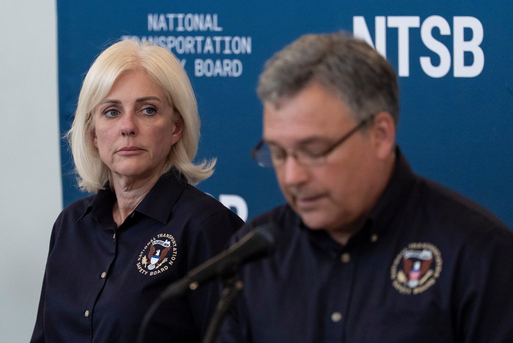 Jennifer Homendy, the NTSB chair, listens to Doug Brazy, aviation accident investigator for the NTSB, speaks during a press conference, Tuesday, March 24, 2026, at LaGuardia Airport in New York. (AP Photo/Yuki Iwamura)