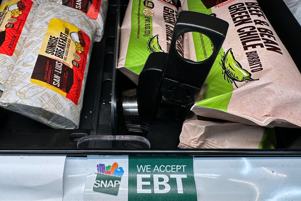 A SNAP EBT sign is displayed on a shelf at a gas station in Riverwoods, Ill., Saturday, Nov. 1, 2025. (AP Photo/Nam Y. Huh)