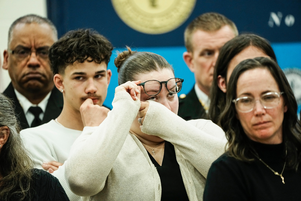 Family members of victims react as they listen Suffolk County District Attorney Raymond A. Tierney during a news conference after Rex Heuermann, accused in Long Island's Gilgo Beach serial killings, pleaded guilty on Wednesday, April 8, 2026, at Suffolk County Police Academy Gymnasium in Brentwood, N.Y. (AP Photo/Eduardo Munoz Alvarez)
