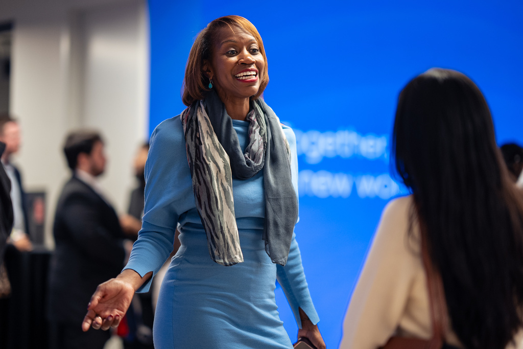 Kendra Parlock, Vice President of Partnership Development at NPower, talks to an NPower alumna during an event at World Wide Technology, Monday, Oct. 20, 2025, in New York. (AP Photo/Angelina Katsanis)