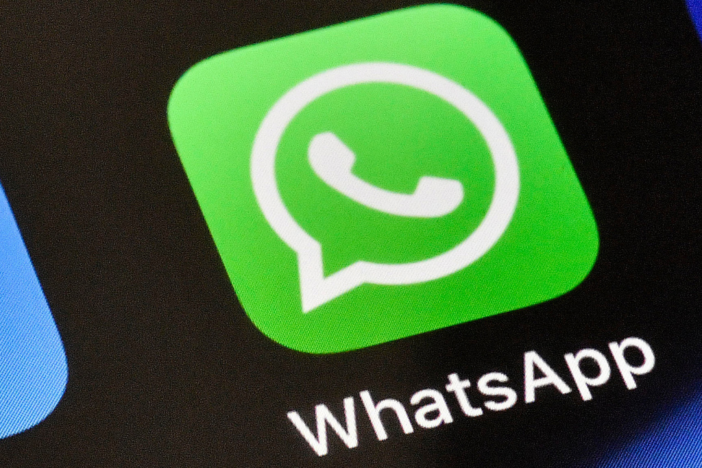 FILE - A WhatsApp icon is displayed on an iPhone, Nov. 15, 2018, in Gelsenkirchen, Germany. (AP Photo/Martin Meissner, File)