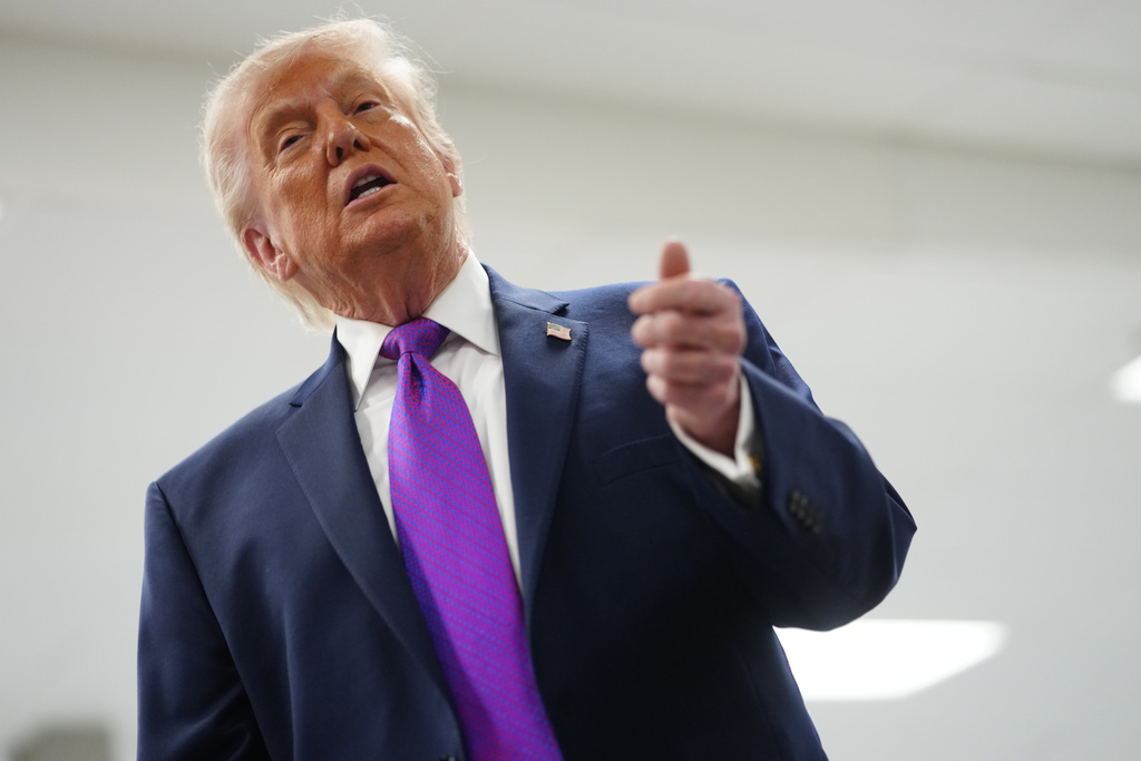 President Donald Trump talks with reporters as he visits Thermo Fisher Scientific, Wednesday, March 11, 2026, in Cincinnati. (AP Photo/Julia Demaree Nikhinson)
