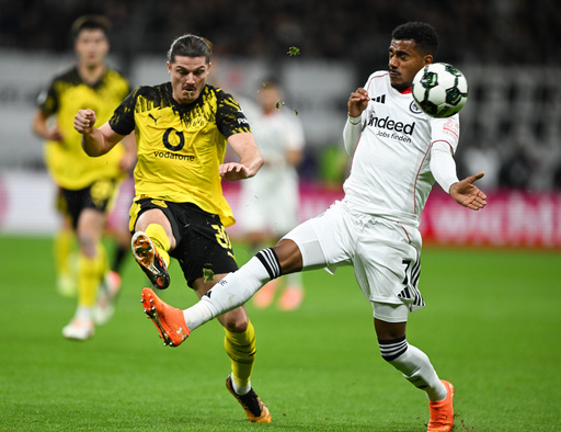 Frankfurt's Ansgar Knauff, right, and Dortmund's Marcel Sabitzer, left, challenge for the ballduring a German soccer cup second round match between Eintracht Frankfurt and Borussia Dortmund in Frankfurt, Germany, Tuesday, Oct. 28, 2025. (Arne Dedert/dpa via AP) Frankfurt's Ansgar Knauff, right, and Dortmund's Marcel Sabitzer, left, challenge for the ballduring a German soccer cup second round match between Eintracht Frankfurt and Borussia Dortmund in Frankfurt, Germany, Tuesday, Oct. 28, 2025. (Arne Dedert/dpa via AP)