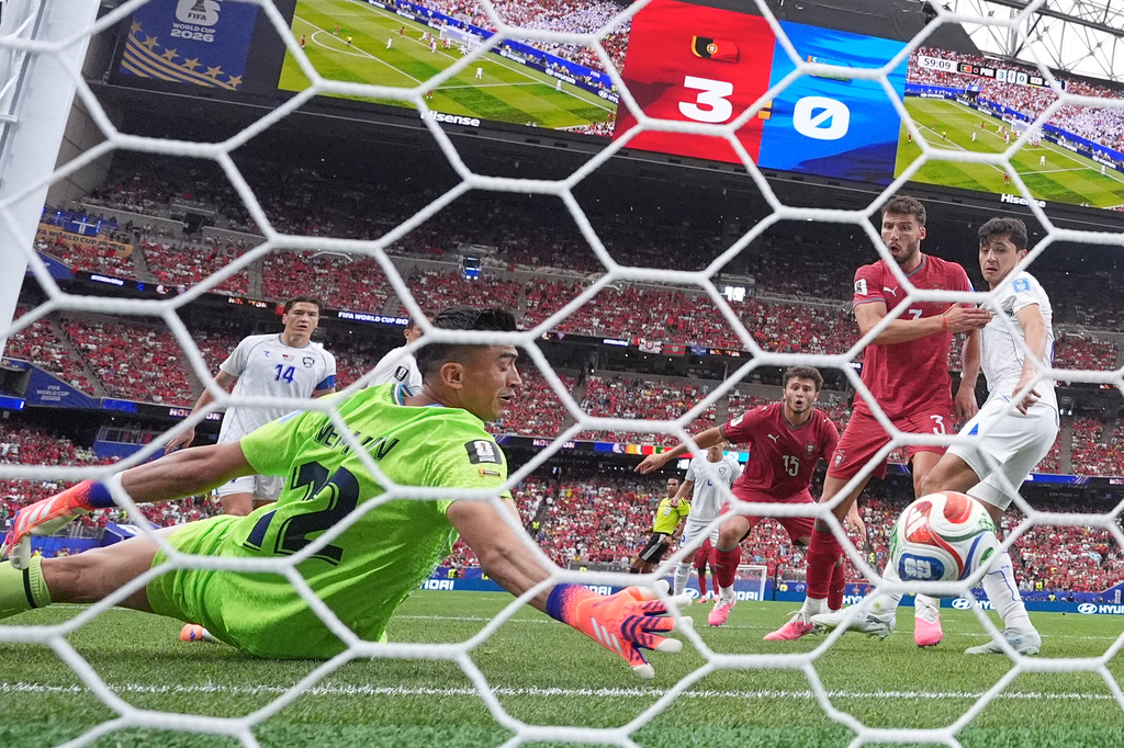 Uzbekistan goalkeeper Abduvohid Nematov (12) scores an own goal during the World Cup Group K soccer match between Portugal and Uzbekistan in Houston, Tuesday, June 23, 2026. (AP Photo/Eric Gay)