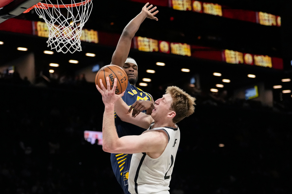 Brooklyn Nets forward Danny Wolf (2) is blocked by Indiana Pacers forward Jarace Walker (5) during the second half of an NBA basketball game, Wednesday, Feb. 11, 2026, in New York. (AP Photo/Yuki Iwamura)