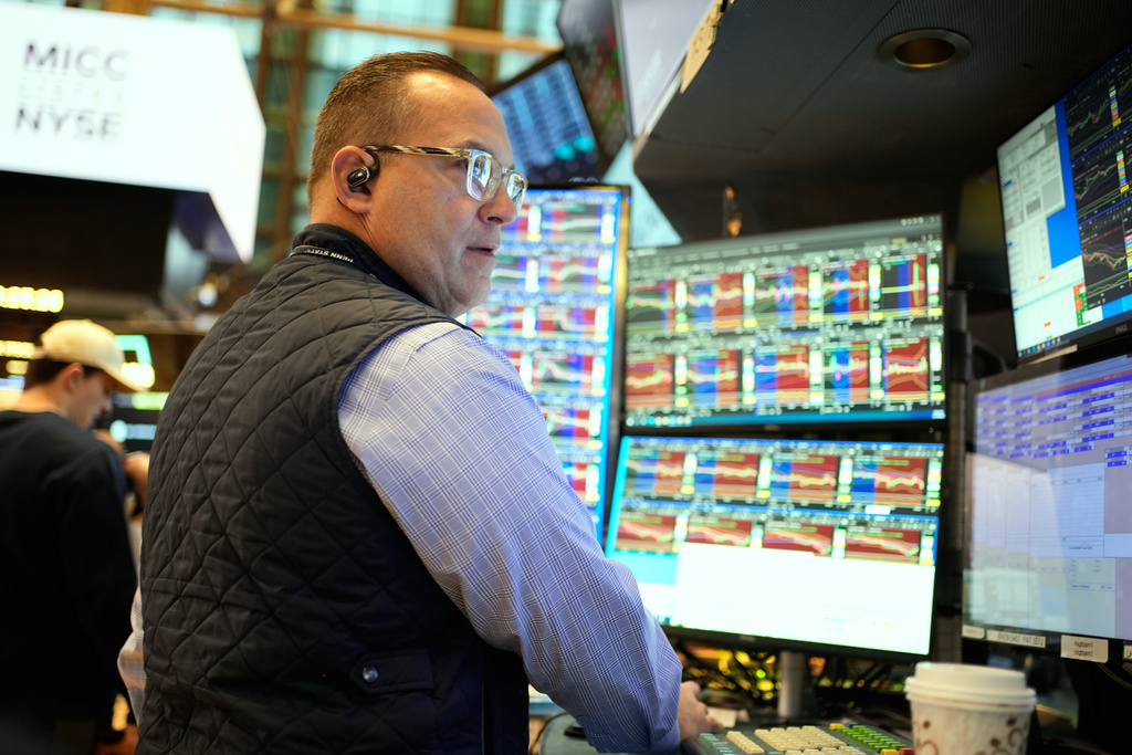Anthony Matesic works on the floor at the New York Stock Exchange in New York, Wednesday, Dec. 10, 2025. (AP Photo/Seth Wenig)