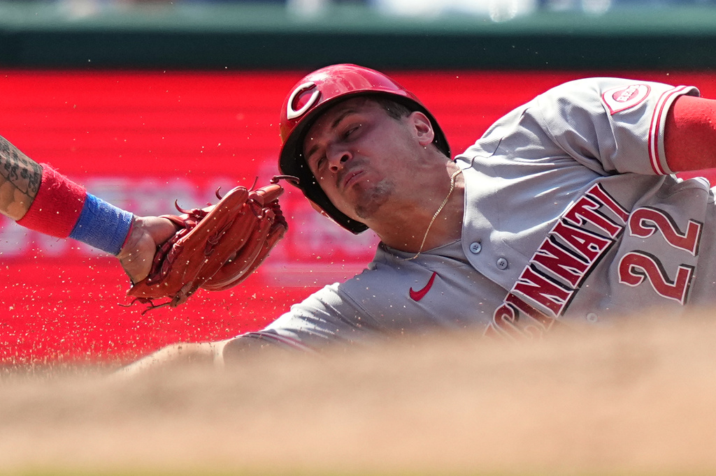 Cincinnati Reds' JJ Bleday slides safely into third ahead of the tag by Philadelphia Phillies third baseman Edmundo Sosa during the seventh inning of a baseball game, Wednesday, May 20, 2026, in Philadelphia. (AP Photo/Matt Rourke)
