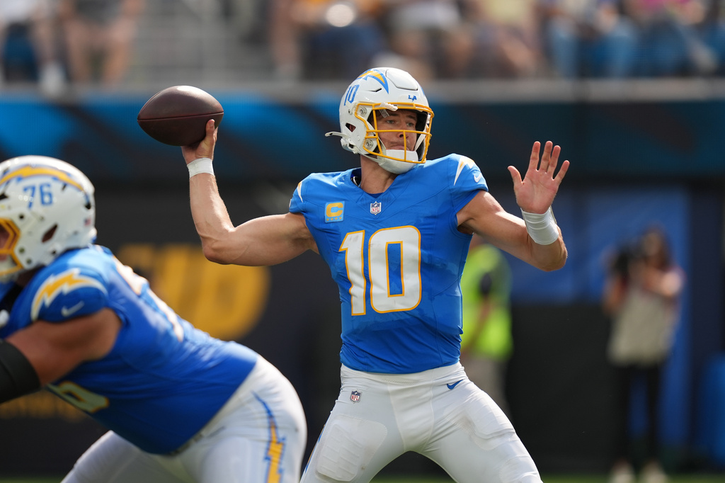 Los Angeles Chargers quarterback Justin Herbert throws a pass during the second half of an NFL football game against the Arizona Cardinals Sunday, Sept. 13, 2026, in Inglewood, Calif. (AP Photo/Gregory Bull)