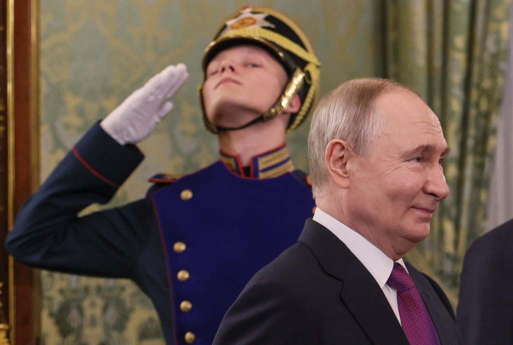 Russian President Vladimir Putin arrives for his meeting with Syrian interim President Ahmad al-Sharaa at the Grand Kremlin Palace in Moscow, on Wednesday, Jan. 28, 2026. (Maxim Shipenkov/Pool Photo via AP)