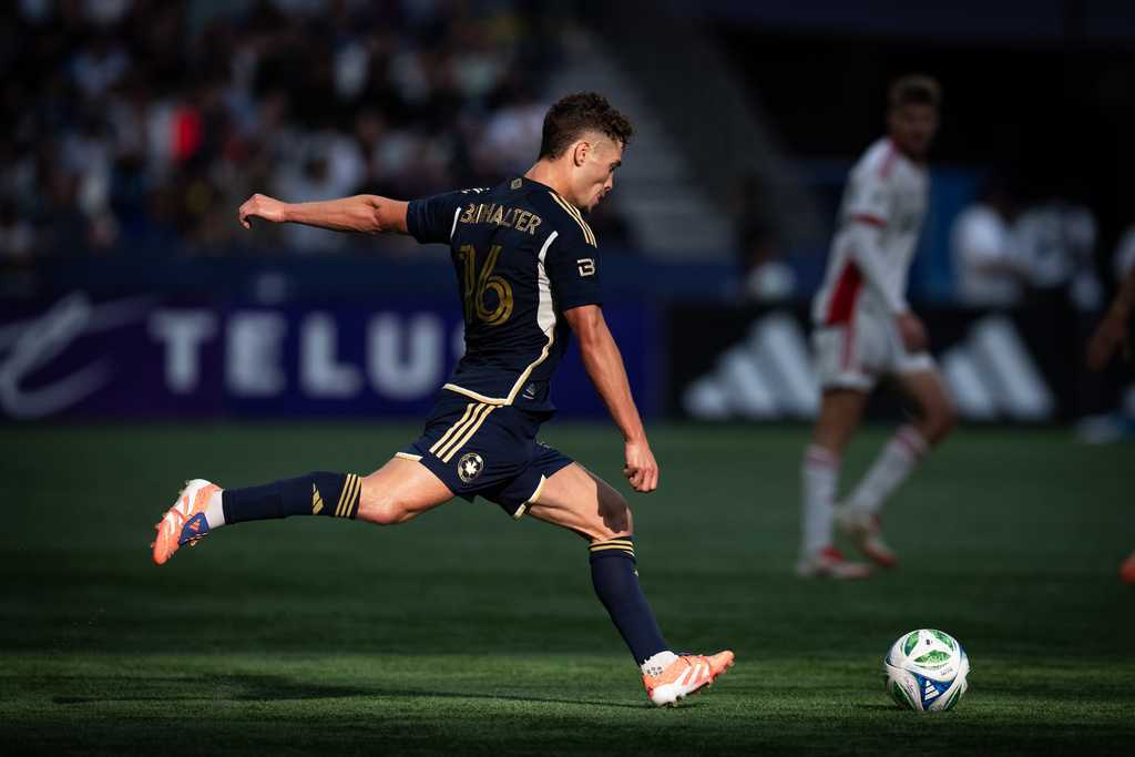 Vancouver Whitecaps' Sebastian Berhalter kicks the ball during the first half of an MLS soccer match against the San Jose Earthquakes in Vancouver, British Columbia, Sunday, Oct. 5, 2025. (Ethan Cairns/The Canadian Press via AP)