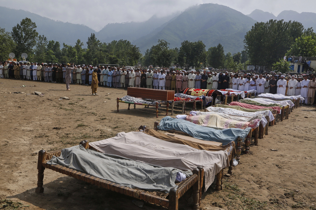 People attend funeral prayers for the victims of Friday's flash flooding, at a village near Pir Baba, Buner district, in Pakistan's northwest, Saturday, Aug.16, 2025. (AP Photo/Muhammad Sajjad)