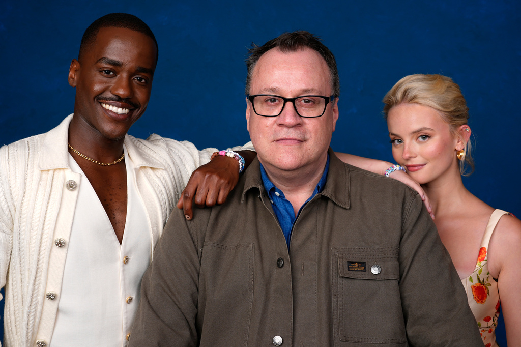 FILE -Ncuti Gatwa, from left, Russell T Davies, and Millie Gibson pose for a portrait to promote "Doctor Who" during Comic-Con International on July 26, 2024, in San Diego. (AP Photo/Chris Pizzello, File)