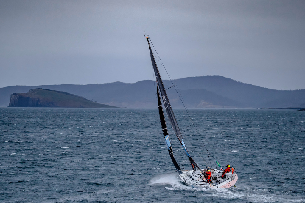 In this photo provided by the Cruising Yacht Club of Australia, the boat BNC is sailed by Michel Quintin and Yann Rigal near Hobart, Australia, Tuesday, Dec. 30, 2025, as they finish the Sydney Hobart yacht race. (Kurt Arrigo/CYCA via AP)