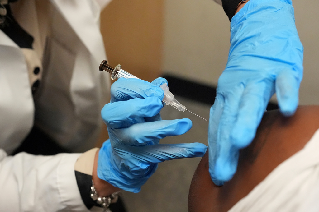 FILE - A patient receives a vaccine protecting against human papillomavirus (HPV) at a pharmacy in Miami, Sept. 9, 2025. (AP Photo/Rebecca Blackwell, File)