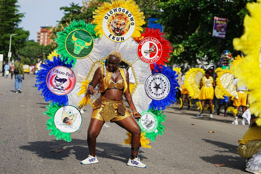 A woman dressed in a costume performs on the street during the Fanti Carnival, in Lagos Nigeria, Monday, April 6, 2026, (AP Photo/Sunday Alamba)