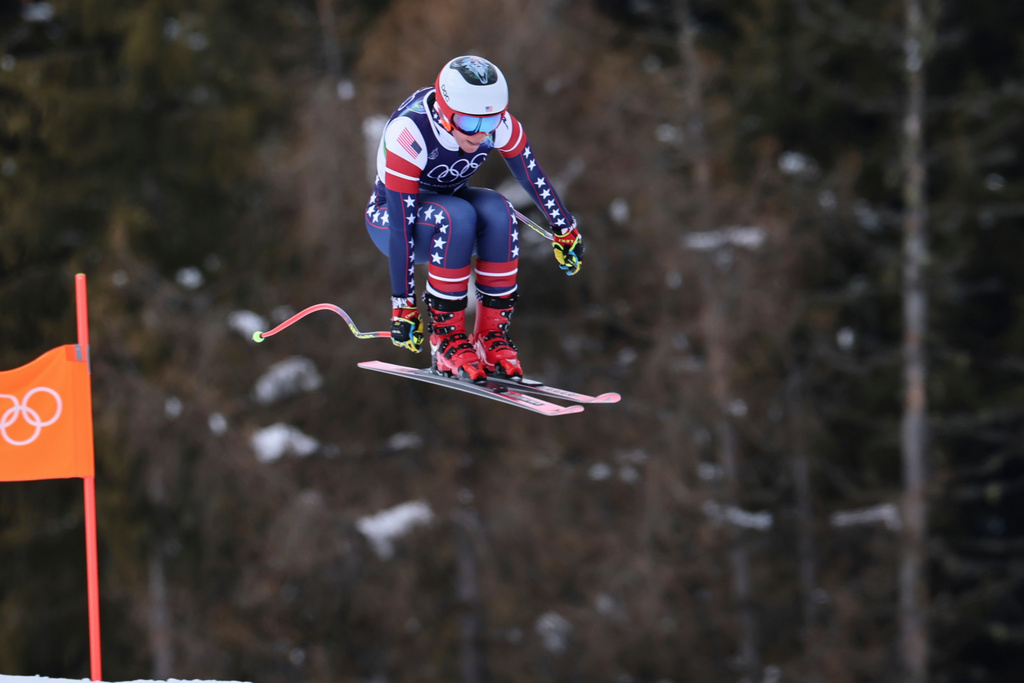 United States' Breezy Johnson speeds down the course during an alpine ski, women's downhill official training, at the 2026 Winter Olympics, in Cortina d'Ampezzo, Italy, Friday, Feb. 6, 2026. (AP Photo/Marco Trovati)