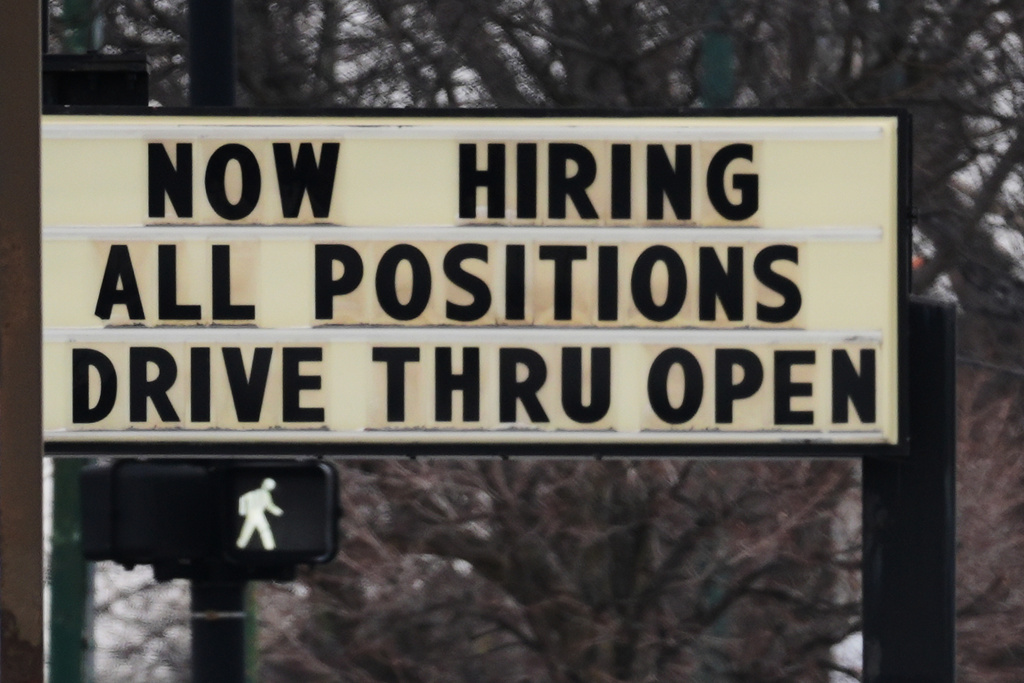 Hiring sign is displayed in front of a restaurant in Chicago, Thursday, Feb. 5, 2026. (AP Photo/Nam Y. Huh)
