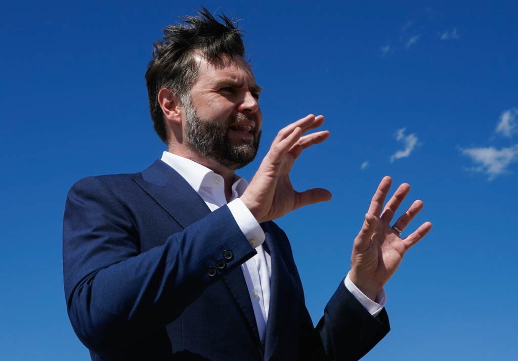 Vice President JD Vance speaks to reporters at Joint Base Andrews, Md., Saturday, June 20, 2026, en route to Switzerland. (Elizabeth Frantz/Pool Photo via AP)