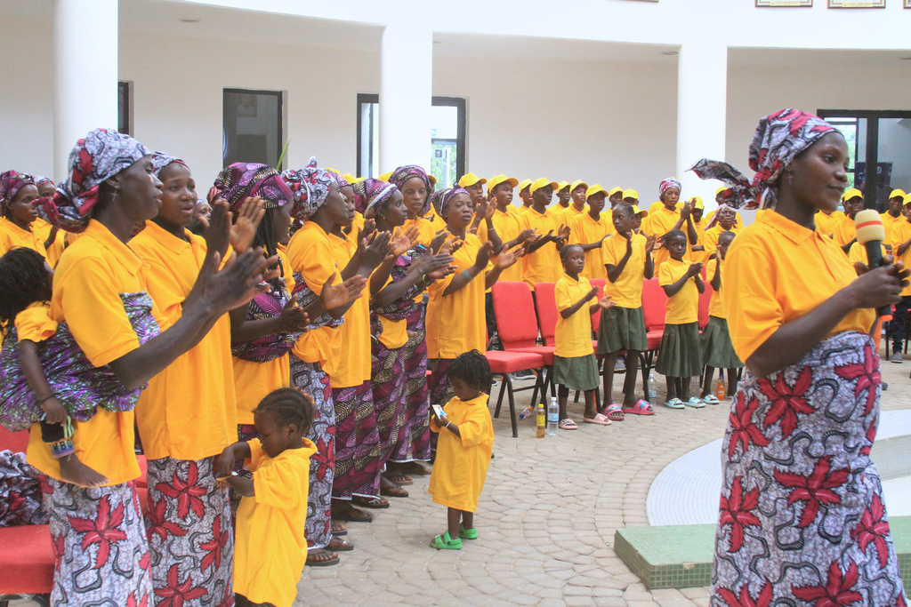 Freed church worshipers who were abducted by gunmen in Kurmin Wali, applaud upon their arrival at the state government house in Kaduna, Nigeria, Thursday, Feb. 5, 2026. (AP Photo/Abel Omotosho)