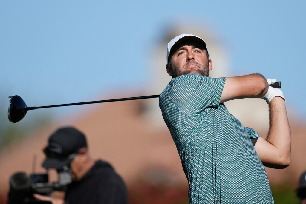 Scottie Scheffler hits his tee shot at the second hole during the final round of the Phoenix Open golf tournament Sunday, Feb. 8, 2026, in Scottsdale, Ariz. (AP Photo/Ross D. Franklin)