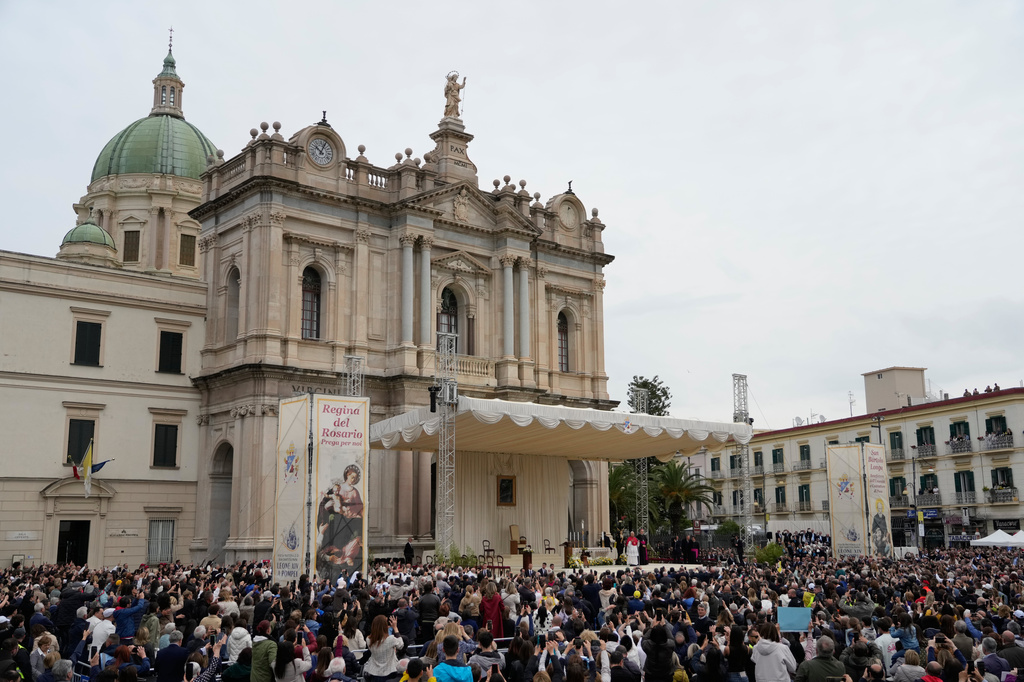 Pope Leo XIV greets the faithful in front of the Pompeii Shrine during his pastoral visit in Pompeii, Italy, Friday, May 8, 2026. (AP Photo/Gregorio Borgia)