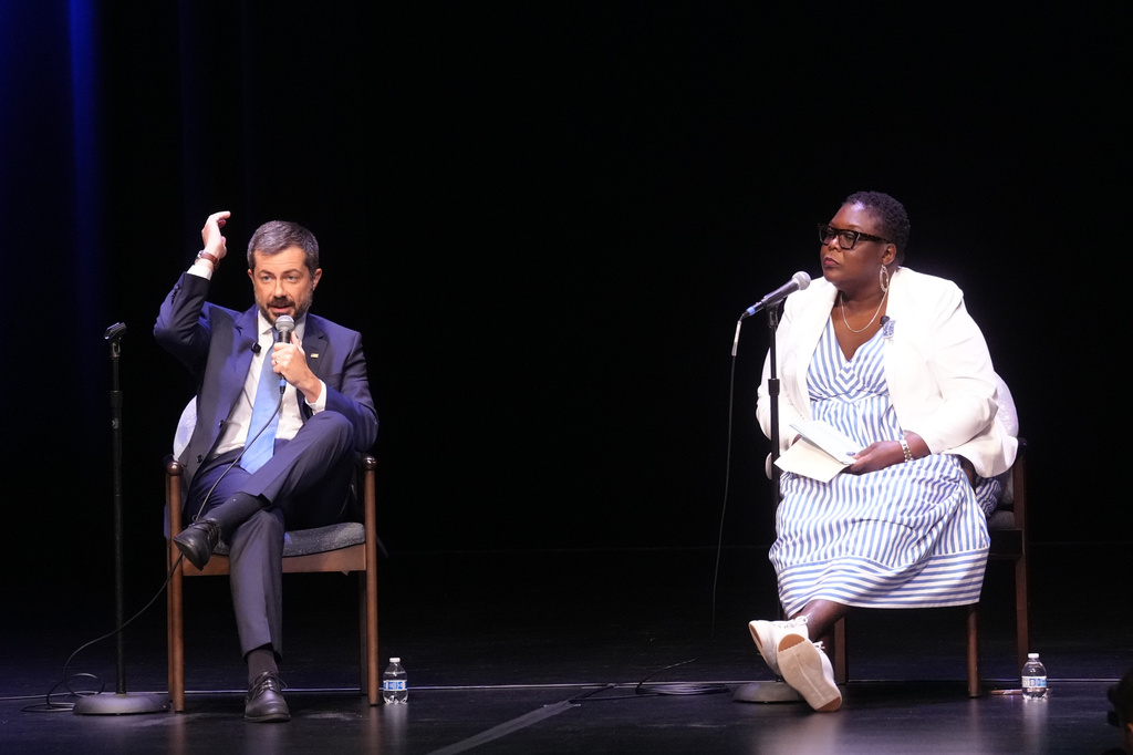 Former Transportation Secretary Pete Buttigieg, left, gestures as he speaks at the South Carolina Democratic Party's Spratt Issues Conference alongside South Carolina Democratic Party chair Christale Spain, Saturday, Aug. 22, 2026, in Florence, S.C. (AP Photo/Meg Kinnard)