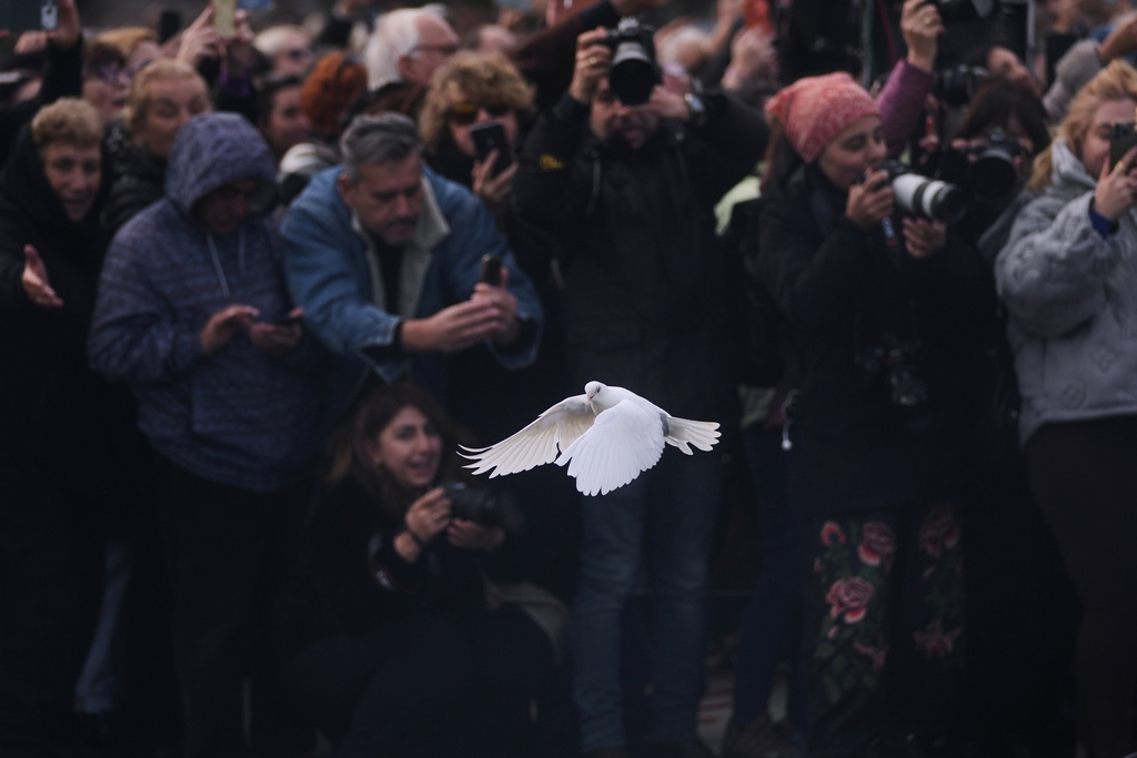 A white dove is released during the Christian Orthodox Epiphany ceremony at the Golden Horn, in Istanbul, Turkey, Tuesday, Jan. 6, 2026. (AP Photo/Francisco Seco)