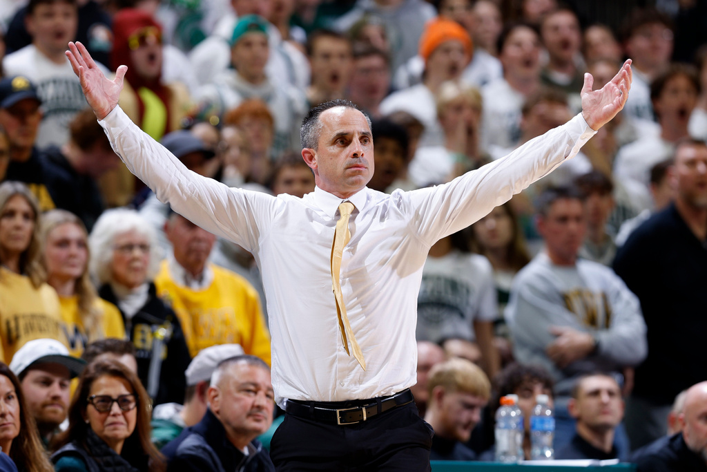 Iowa coach Ben McCollum gestures during the first half of an NCAA college basketball game, Tuesday, Dec. 2, 2025, in East Lansing, Mich. (AP Photo/Al Goldis)