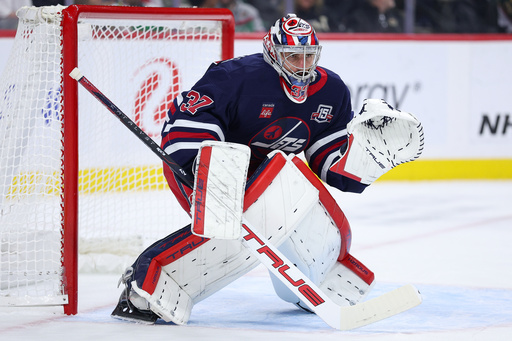 Winnipeg Jets goaltender Connor Hellebuyck (37) defends his net against the Minnesota Wild during the first period of an NHL hockey game Tuesday, Oct. 28, 2025, in St. Paul, Minn. (AP Photo/Matt Krohn) Winnipeg Jets goaltender Connor Hellebuyck (37) defends his net against the Minnesota Wild during the first period of an NHL hockey game Tuesday, Oct. 28, 2025, in St. Paul, Minn. (AP Photo/Matt Krohn)